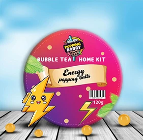 Bubble Tea Home Kit featuring energy popping balls in a round container with a lightning bolt graphic and bright, energetic colors.