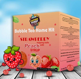 Popping Bobby Bubble Tea Home Kit with 280g strawberry popping balls and strawberry syrup, featuring a bright, playful design.